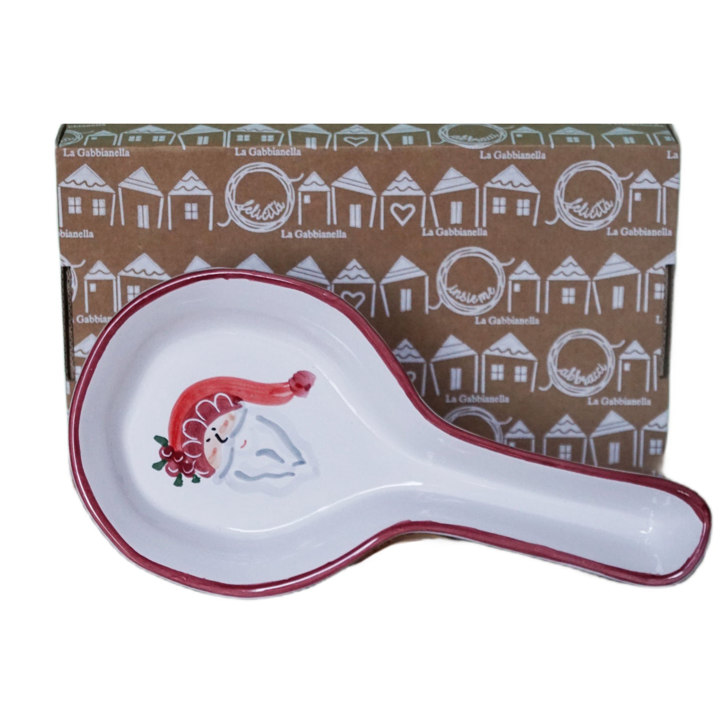 Spoon rest with Santa Claus design in front of a branded gift box