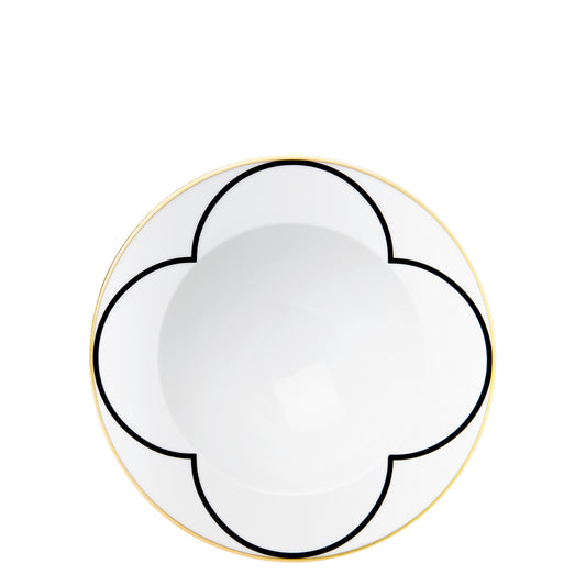 A black and white geometric patterned plate with gold trim.