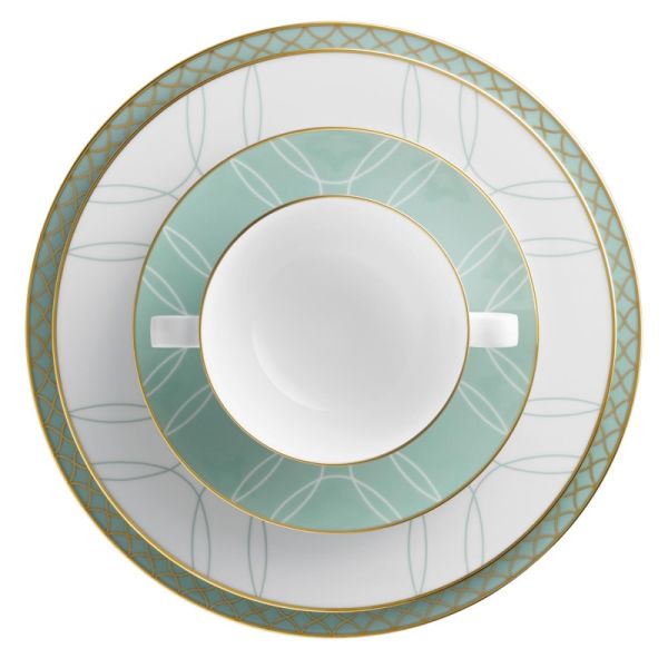 Set of two ceramic plates with decorative green and gold rim on a white background