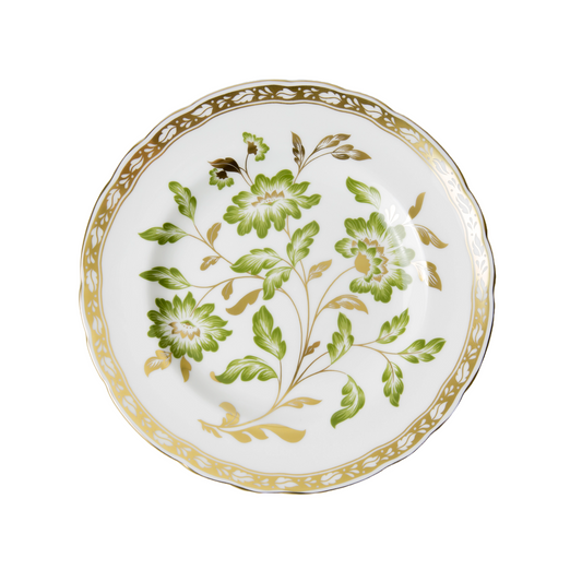 Decorative plate with green floral design and gold accents on a white background