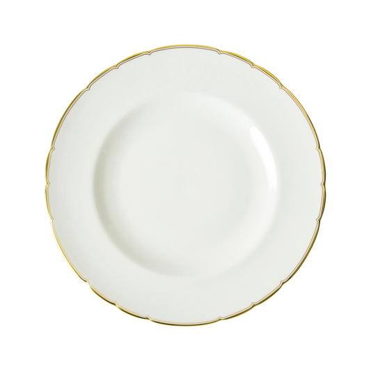 White dinner plate with gold rim on a white background