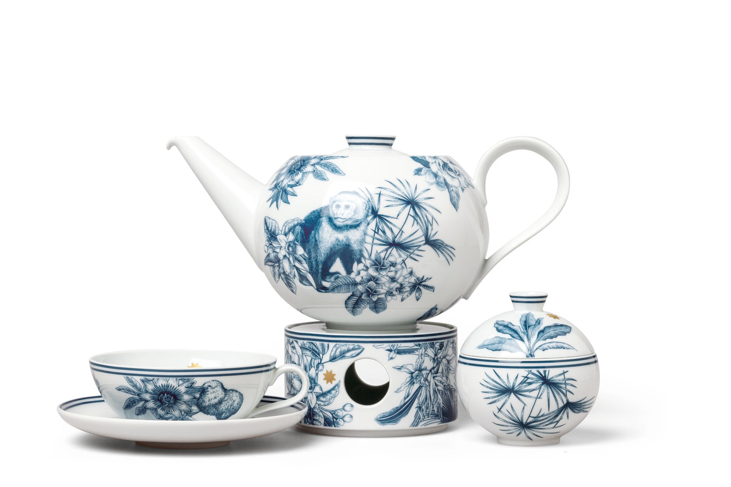 Tea set with blue and white tropical designs on a white background