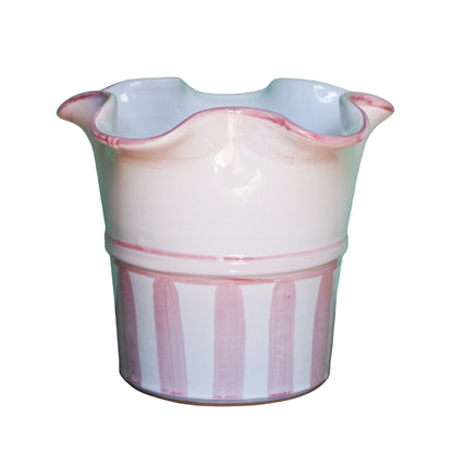 Ceramic flower pot with pink rim and striped design on a white background
