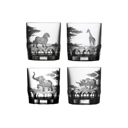 Four crystal double old fashion glasses with safari animal etchings of a tiger, giraffe, elephant, and rhino on a white background. 