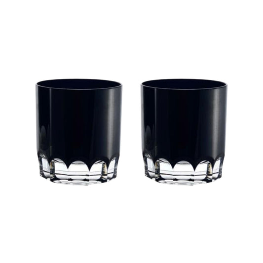 Two black crystal tumblers with decorative bases on a white background