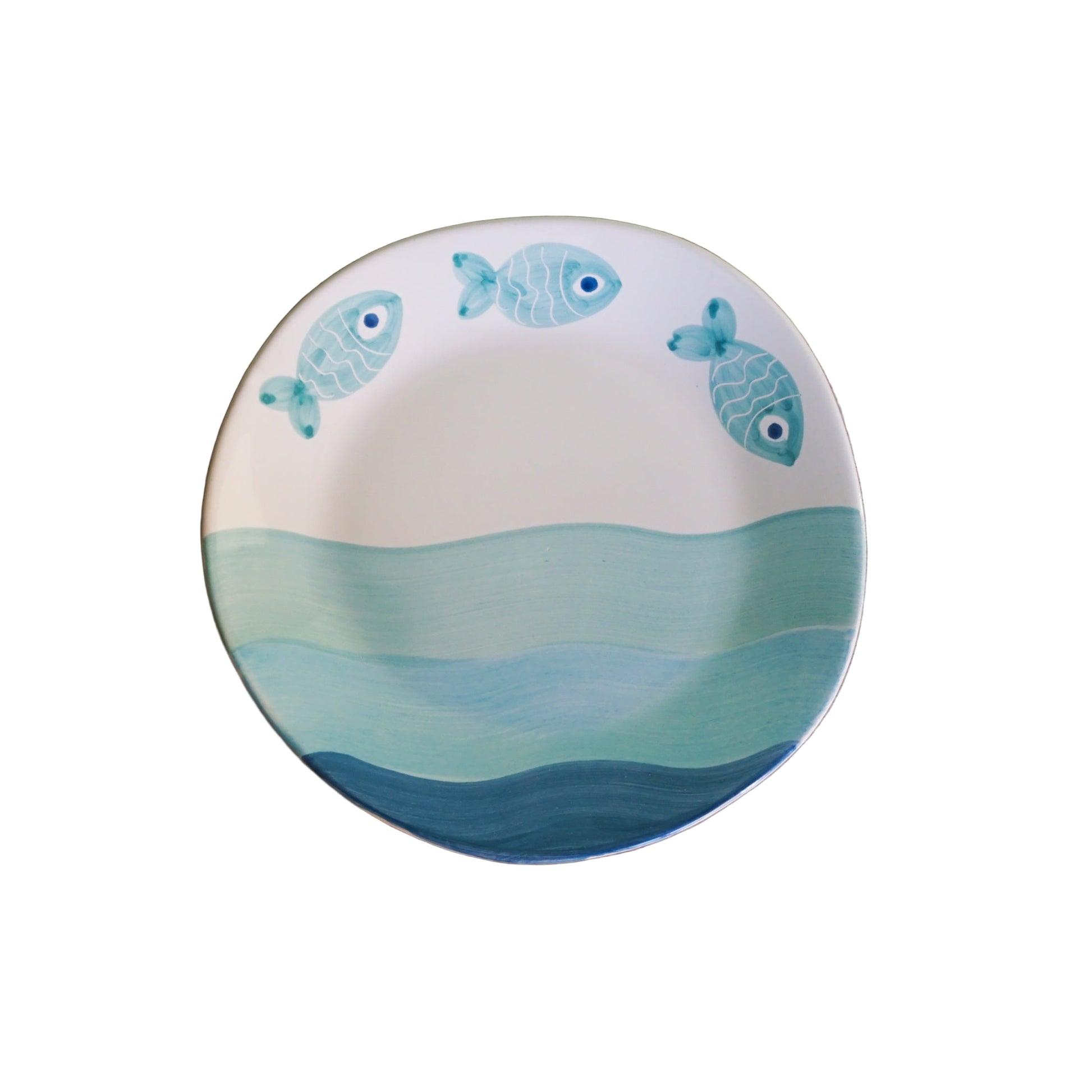 Ceramic plate with fish design on a white background