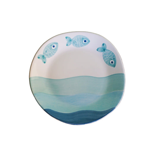 Ceramic plate with fish design on a white background