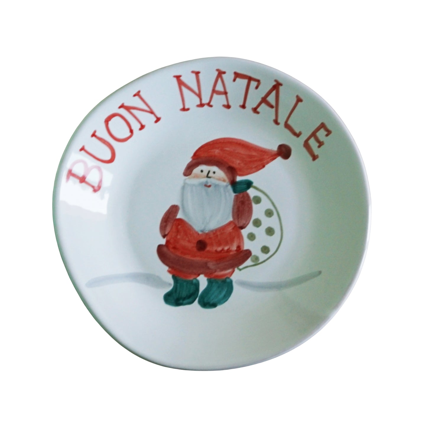 Round plate with Santa Claus illustration and 'Buon Natale' text on a white background