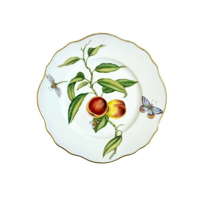 Decorative plate with botanical design featuring fruits and insects on a white background