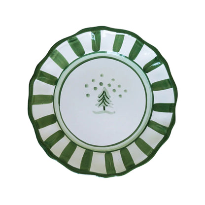 Decorative plate with green and white design on a white background