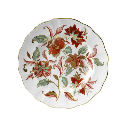 Decorative fall plate with red, green, and gold floral design on a white background