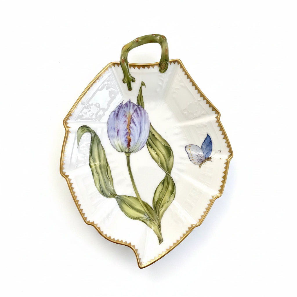 Decorative porcelain plate with floral design on a white background