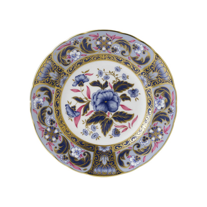 Decorative bone china plate with blue and purple floral design on a white background