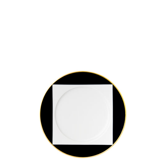 A black and white geometric patterned porcelain plate with gold trim.