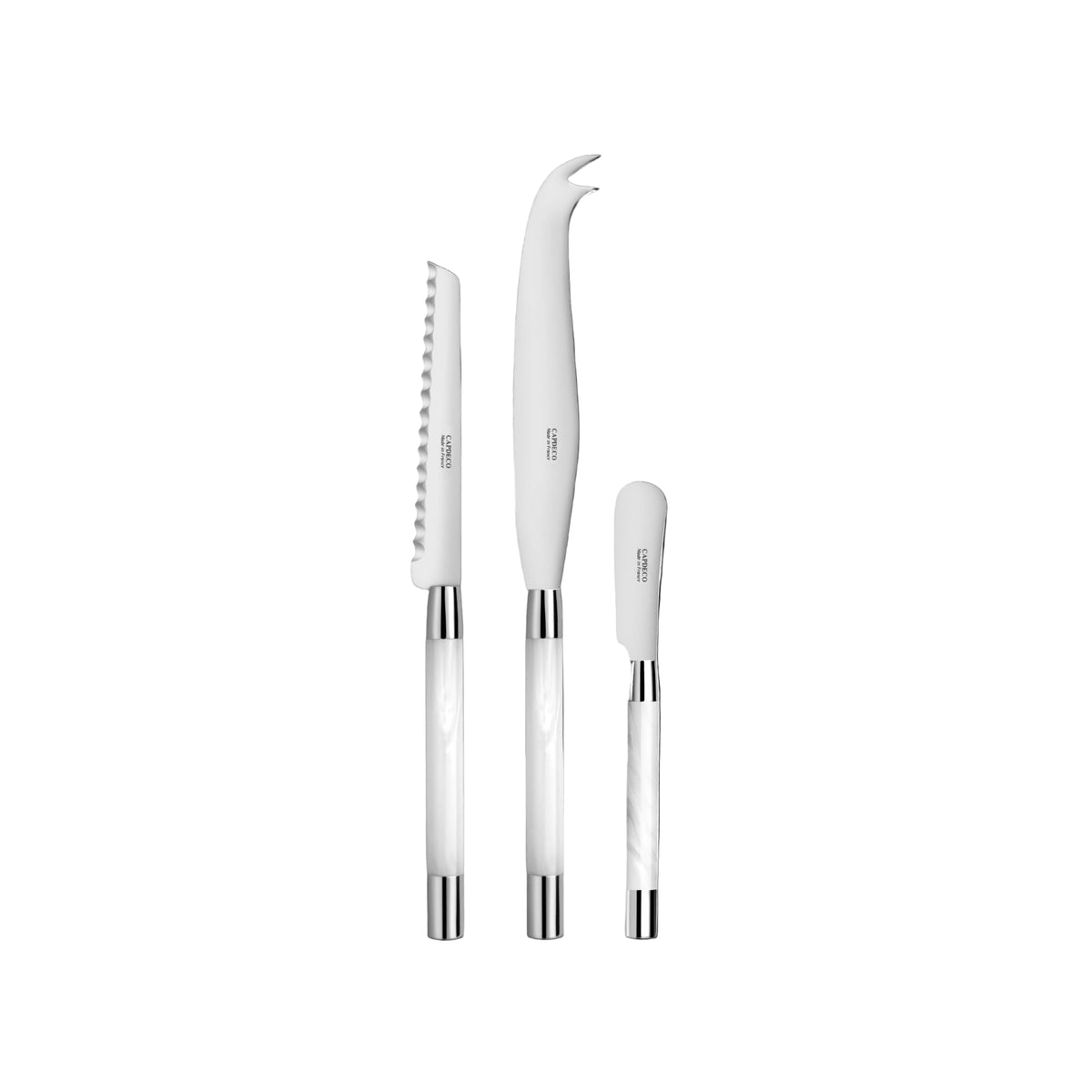 Set of white cheese knives with silver and white handles on a white background