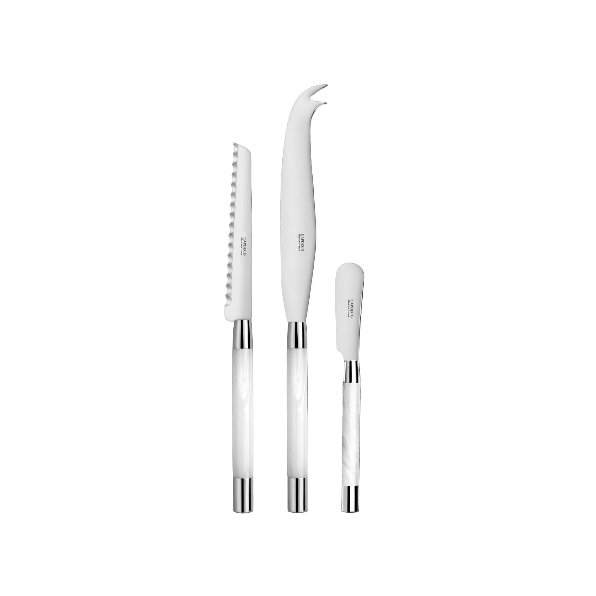 Set of white cheese knives with silver and white handles on a white background