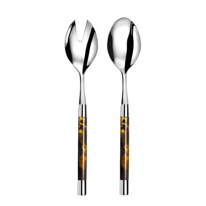 Silver salad servers with tortoiseshell handles on a white background