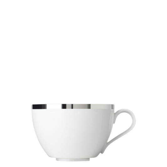 White porcelain teacup with a platinum rim on a white background