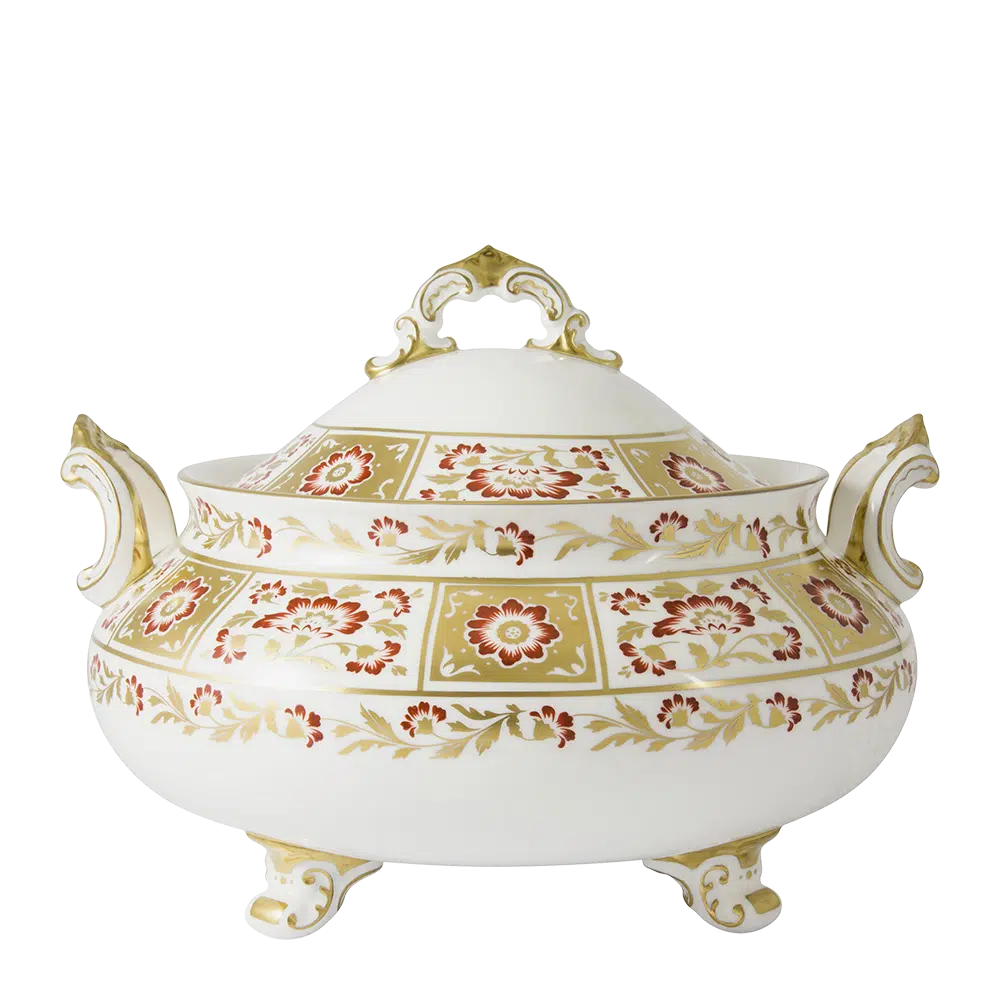 Decorative ceramic tureen with floral patterns on a white background