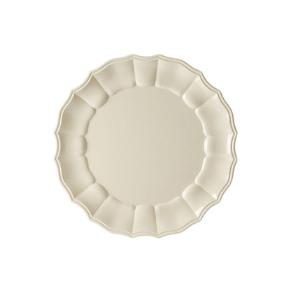 Ivory acrylic plate with scalloped edge on a white background