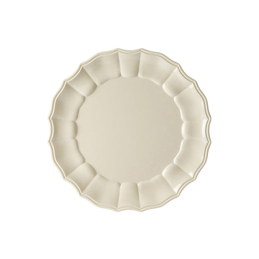 Ivory acrylic plate with scalloped edge on a white background