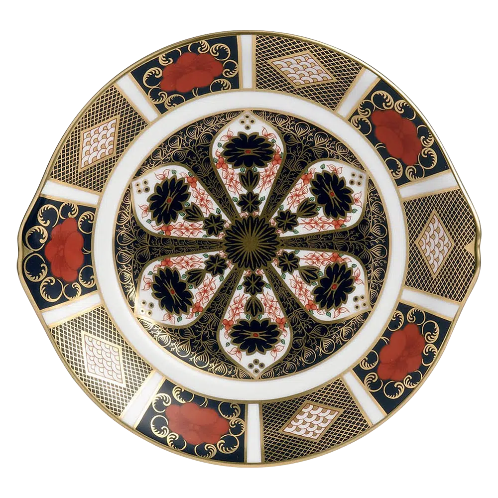 Decorative plate with intricate gold, black, and red patterns on a white background
