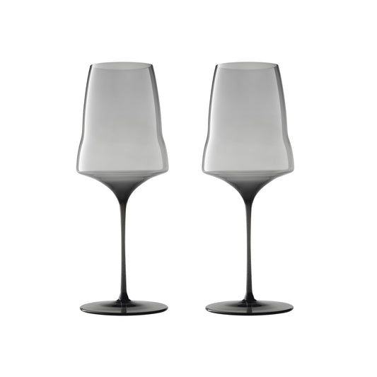 Two modern wine glasses with a smoky translucent design, fading from light gray at the wide bowl to dark charcoal at the base, shown side-by-side on a white background.