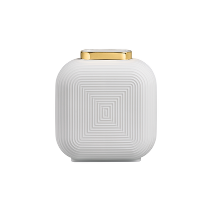 A luxury white porcelain vase with a geometric relief pattern and a golden rim at the top edge, displayed against a plain background.