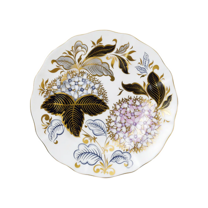 Decorative winter plate with purple and blue floral and leaf patterns on a white background