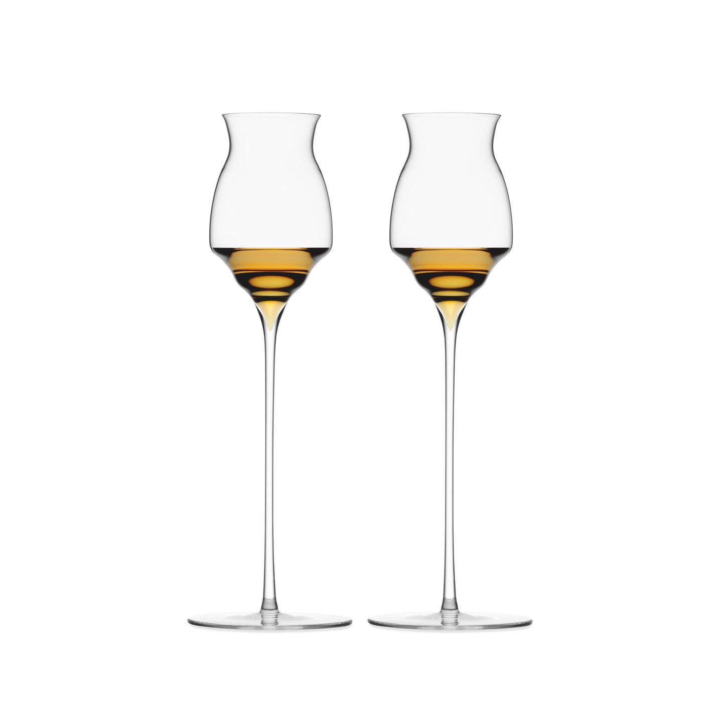 Two stemmed cordial glasses with a small amount of liquor on a white background