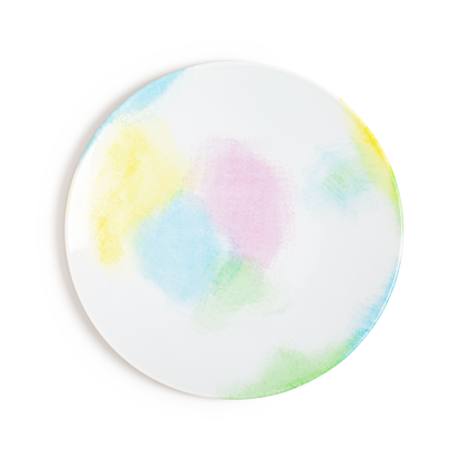 A Limoges porcelain plate with a hand-painted design featuring slightly acid pastel shades creating a powdery effect.