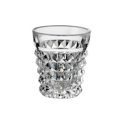 Clear acrylic tumbler with diamond-cut pattern on a white background