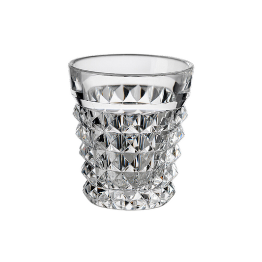 Clear acrylic tumbler with diamond-cut pattern on a white background