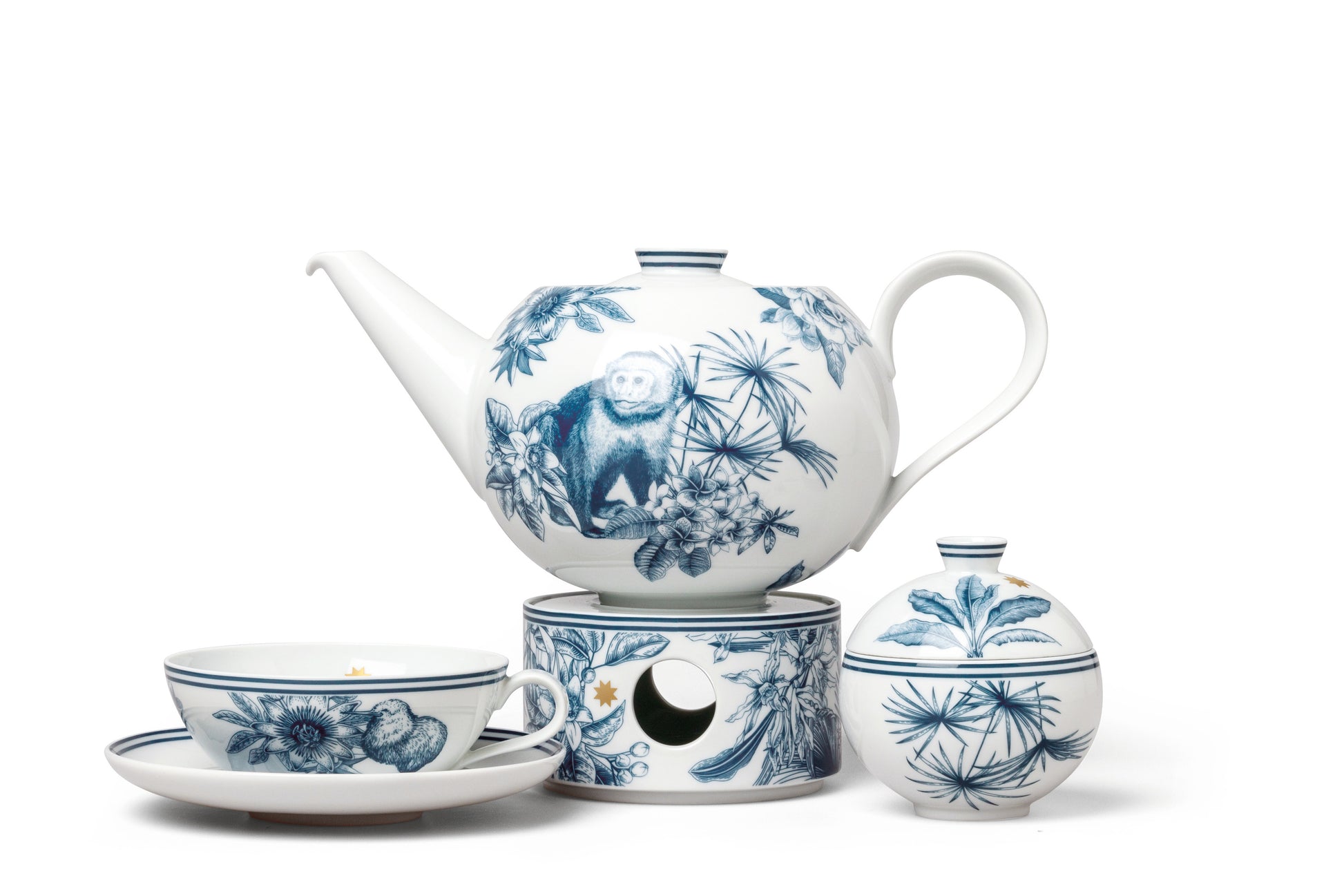 Tea set with blue and white tropical designs on a white background