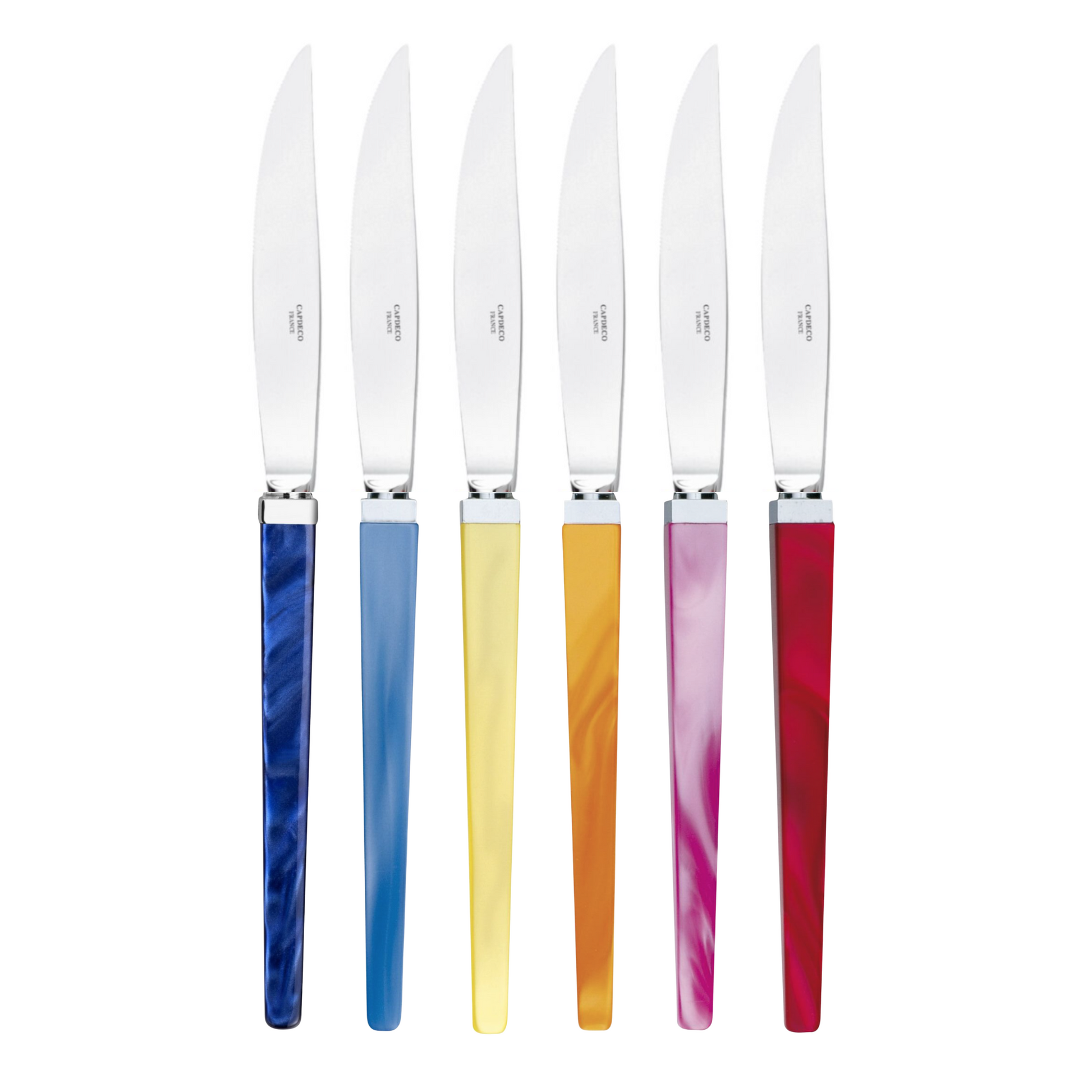 Set of six steak knives with colorful handles on a white background