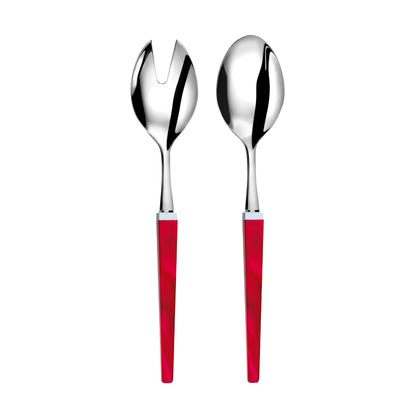 Silver salad servers with red handles on a white background