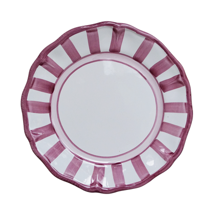 White ceramic plate with purple stripes on a white background