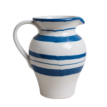 White ceramic pitcher with blue stripes