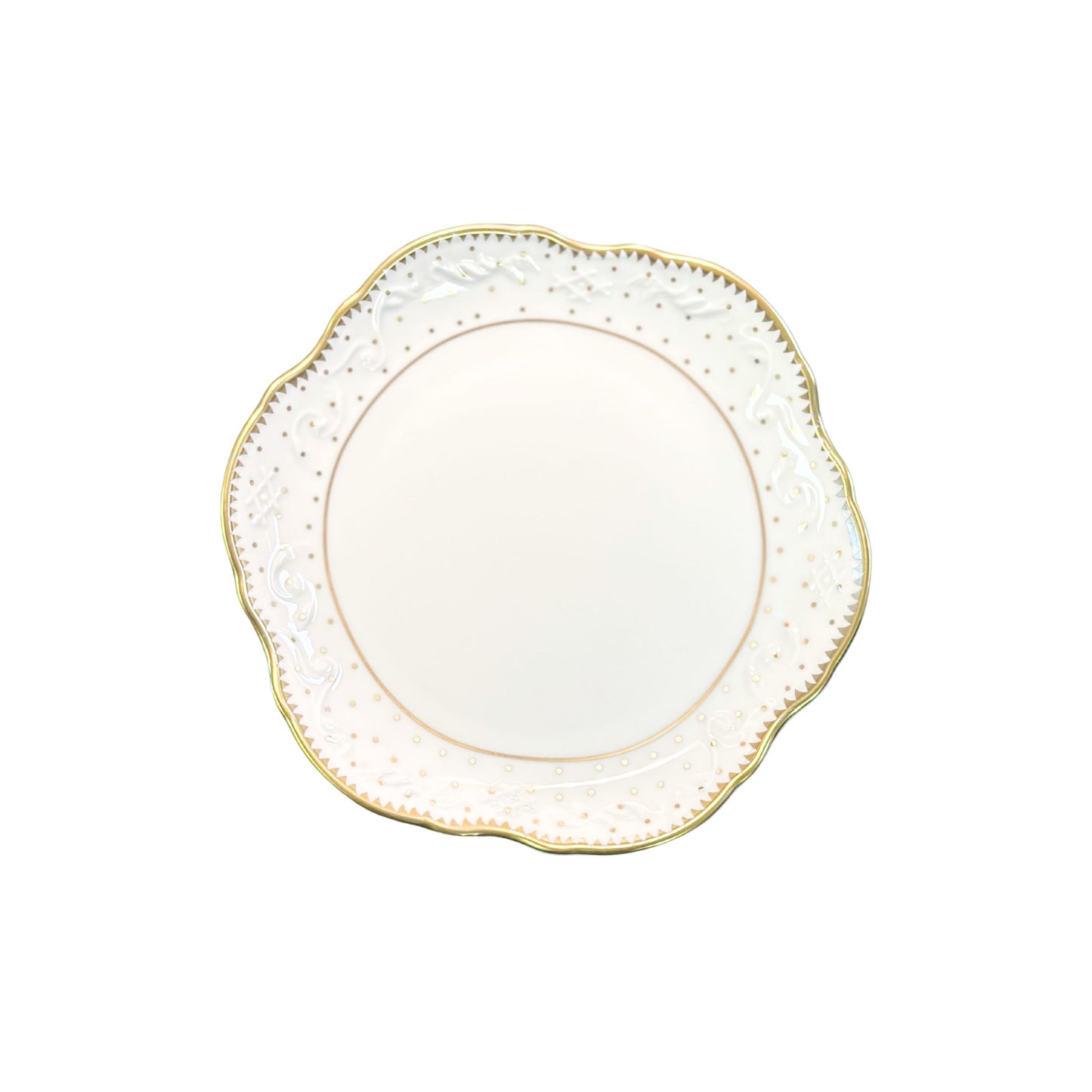 Decorative plate with gold rim and intricate detailing on a white background