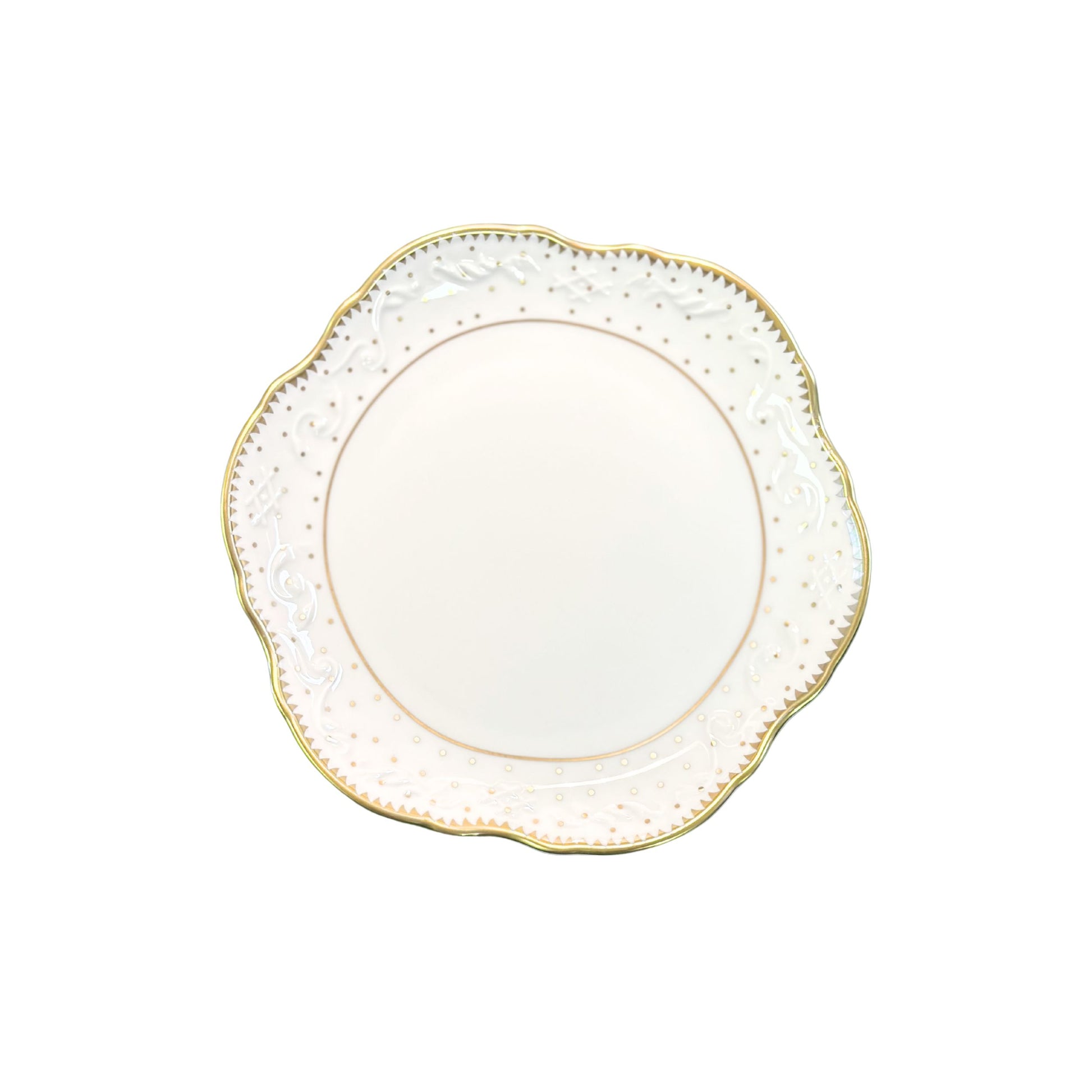 Decorative plate with gold rim and intricate detailing on a white background