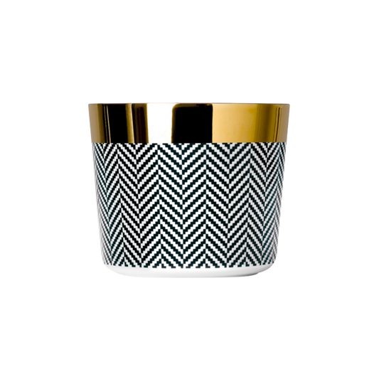 A black and white porcelain champagne tumbler with a gold rim and interior, featuring a geometric pattern.