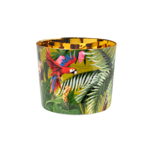 A multicolored luxury porcelain champagne tumbler with a gold interior and a design that includes jungle foliage and a colorful parrot.