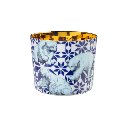 A multicolored porcelain champagne tumbler with a gold interior, decorated with polar bears