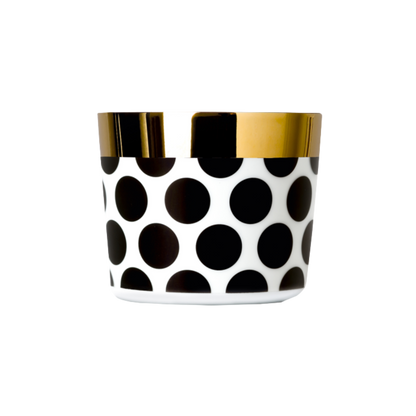 A white porcelain champagne tumbler with a gold rim and interior, against a plain background.