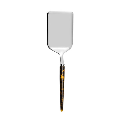 Metal lasagana server with tortoise shell handle on a white background