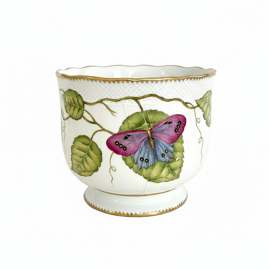Hand painted decorative vase by Anna Weatherley with butterfly and leaf design on a white background