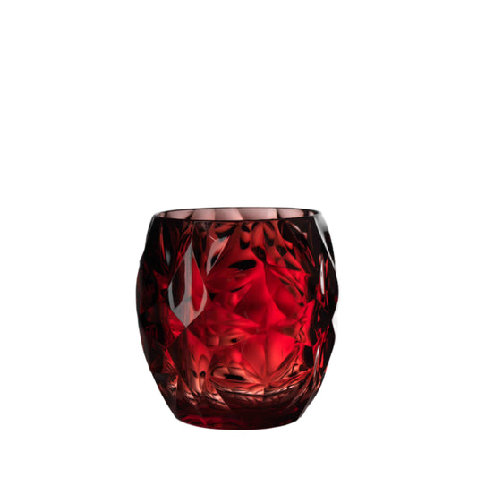 Red acrylic tumbler with cut design on a white background