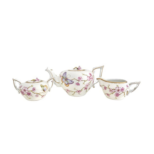 Tea set with cherry blossom and butterfly design on a white background
