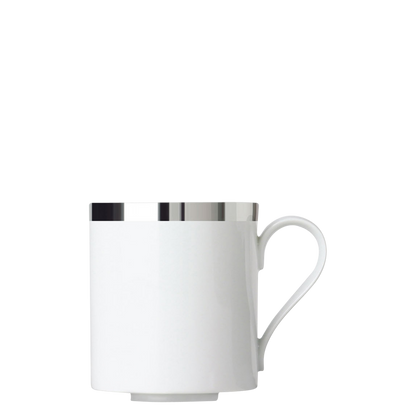 White porcelain mug with silver rim on a white background