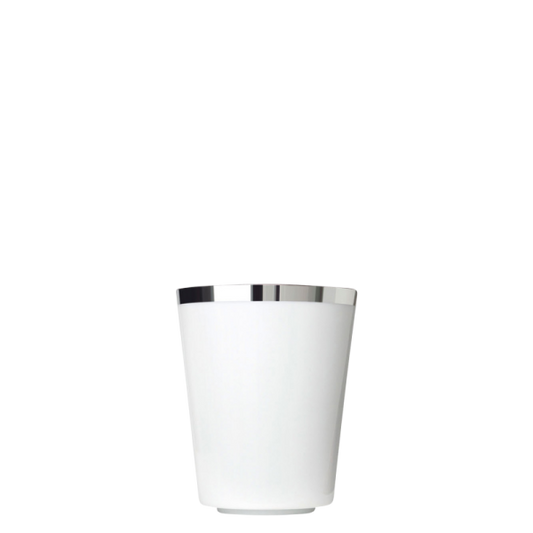 White porcelain coffee cup with a silver rim on a white background
